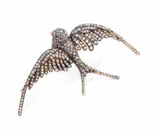 Louis, Missouri $700-900 22 ImPoRtAnt jewelry 36 a Fine Silver topped Gold, diamond and Ruby Swallow Brooch/Hair ornament, French, in a realistic design, containing numerous rose cut diamonds and two