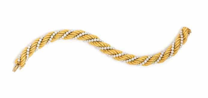 145 146 148 147 146 an 18 Karat Yellow Gold and cultured Seed Pearl Bracelet, consisting of a textured yellow gold rope chain coiled with a strand of seed pearls measuring approximately 2.