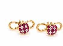 a pair of cuffinks and four shirt studs, containing 78 round mixed cut rubies weighing