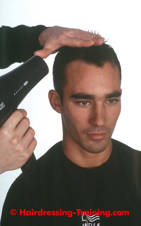 Step By Step 10: Blow Drying Here, our stylist is using a very hot hairdryer and their hand to create a flat
