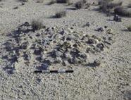 1022 Mound of stones (ht. 0.20 m; diam. 0.90 m). AK0.1023 Sub-circular silty cleared area (diam. 1.