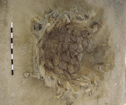 It appears that this hearth was excavated by the previous expedition and subsequently backfilled, as represented by the cut and sand in-filling. AK1.2* Roughly circular hearth (max. diam. 1.