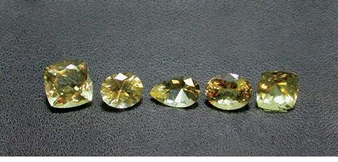 Figure 3. These five faceted scapolites (4.14 7.50 ct) and 16 rough crystals (0.74 2.15 g) from Ihosy were studied for this report. Photos by E. Castaman.