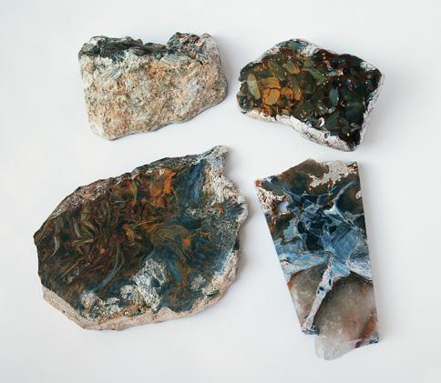 three flat unpolished slabs from author PJH s personal collection (purchased at the 2008 and 2009 Tucson gem shows). Two of the six Namibian samples contained traces of the original host rock.
