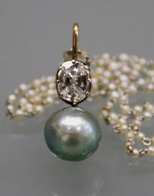 Figure 15. This 10.35 9.98 9.18 mm (6.72 ct) natural pearl had a rare untreated green-gray color. Figure 16.