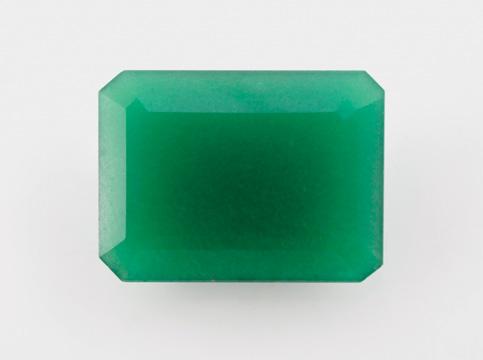 Figure 43. This 25.04 ct translucent green specimen, which proved to be glass, is unusual for its crystalline features. Photo by G. Choudhary. following properties: RI 1.745; hydrostatic SG 4.