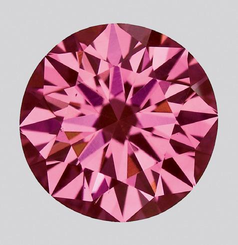 Figure 3. This 0.61 ct round brilliant from Apollo Diamond is an example of the strongly colored pink synthetic diamonds now being produced by the CVD method. Photo by Jian Xin Liao.
