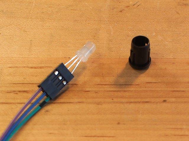 Note the position of the long leg of the NeoPixel -- this is GND. Make a black mark on one wire at both ends and plug the GND leg into this space on the connector to keep track of the wiring order.