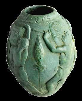 Roman Museum. Used for storing oil or perfume, the container is decorated with a satyr halfgoat, half-man and three male figures.