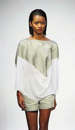Now segue to a one-sleeve white silk blouse, its armhole strewn with a vertical ruffle, as at Riccardo Tisci for Givenchy.