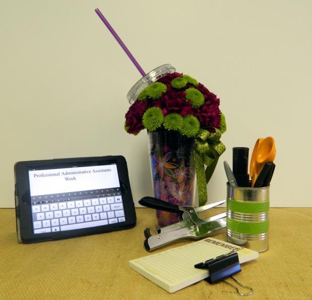 Spring/Summer Administrative Assistant s Day Arrangement Flowers/Supplies needed: 1 Insulated tumbler ¼ Block floral foam 7 Stems Carnations 3 Stems Green Button Poms Scissors