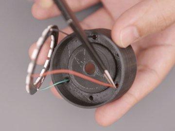 Use tweezers to help thread the wires through the