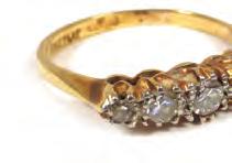 Lot 553 553 An 18ct yellow gold ring set fi ve graduated diamonds, ring size M. 2.