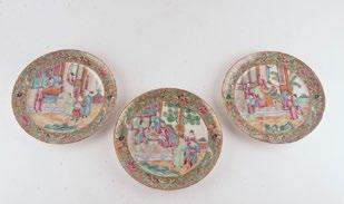1093B CHINA, CANTON Three Cantonese porcelain plates decorated with polychrome enamels of court scenes surrounded by flowers and