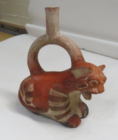 The feline vessel chosen from the Museo Larco s website is noted as Bottle Neck Handle Stirrup Sculptural.