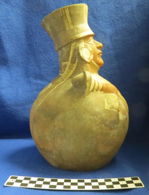 How Acquired: Purchase Remarks: Stamp Appraised 1968 B.A. Brown Author s Description: Red and cream-colored globular jar of elite figure holding a staff in right hand and shield in left hand, has headdress and earplugs.