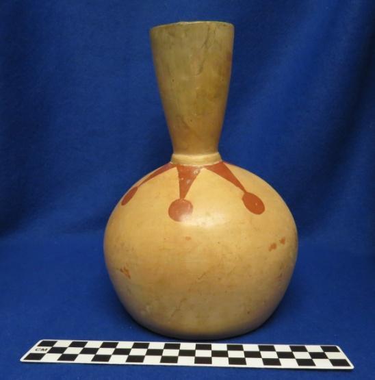 Milwaukee 2, Wi How Acquired: Gift Remarks: Stamp B. Brown 1979 Author s Description: Red and cream-colored stirrup-spout bottle with geometric designs. Measurements: Height of Body = 11.