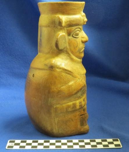 How Acquired: Gift Remarks: blank Author s Description: Red ware warrior effigy jar with black paint. Headdress has animal face and figure is holding a weapon and shield.