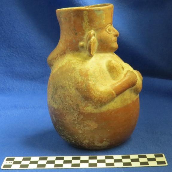 How Acquired: Gift Remarks: blank Author s Description: Red and cream-colored jar of woman holding child, woman has headdress and earplugs. Measurements: Height of Vessel = 17.