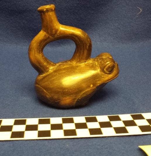How Acquired: Gift Remarks: blank Author s Description: Fraudulent black ware stirrup-spout vessel molded into a frog. Measurements: Height of Vessel = 9.8 cm Height of Body = 4.