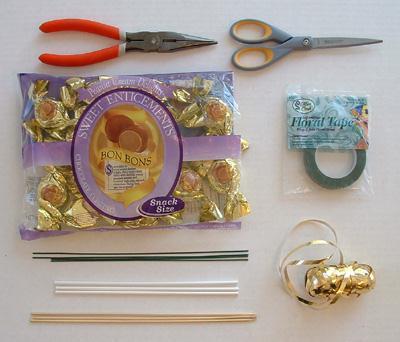 lollipop sticks, green floral tape, gold curling ribbon (optional), and tools.