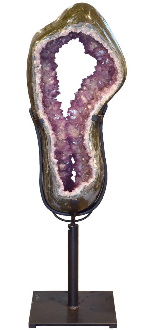 TWO-SIDED AMETHYST This amazing pass-through amethyst slice is in a rotating base and stands nearly 5 feet tall.