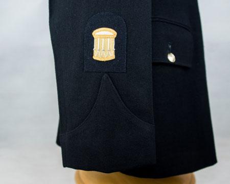 CSgt Bugler rank badge (drum): Embroidered (gold on dark blue) Effective October 2017 Lower right arm - centrally, bottom edge of badge 10mm above point of sleeve slash Sgt Bugler rank badge: