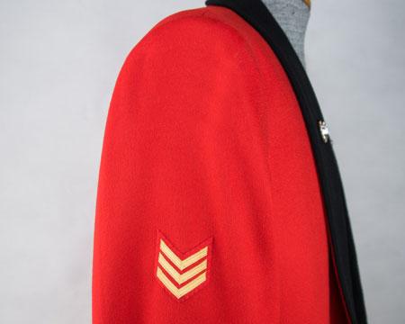 scarlet) Upper right arm - centrally, point of lowest chevron 170mm below shoulder seam.