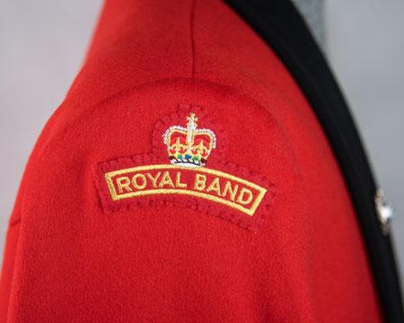 on scarlet) Upper right arm - centrally, point of lowest chevron 170mm below shoulder seam ROYAL