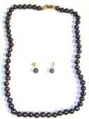 $150 (5555/11546) BEAUTIFUL SINGLE STRAND BLACK PEARL NECKLACE AND EARRING SET- Pearl necklaces represent a fashionable way of accessorizing your outfit because of their