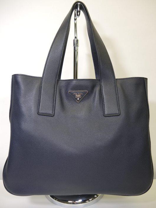 PRADA Navy Soft Sided Tote Retailed for $1,990, sold in one day for $1,000.