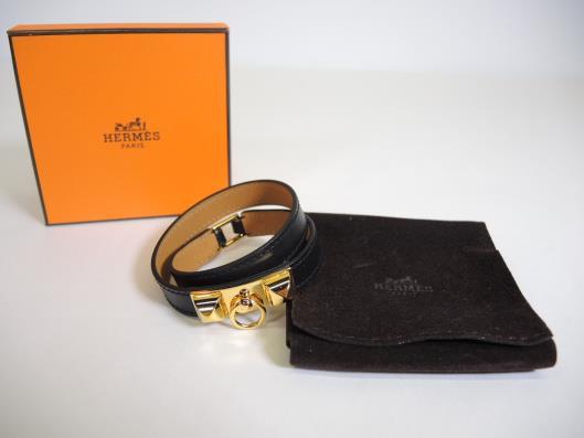 HERMÈS Black and Gold Rivale Double Tour Bracelet Retails for $560, sold in one day for $399. 09/30/17 This never been used piece from 2011 is a simple and classic statement.