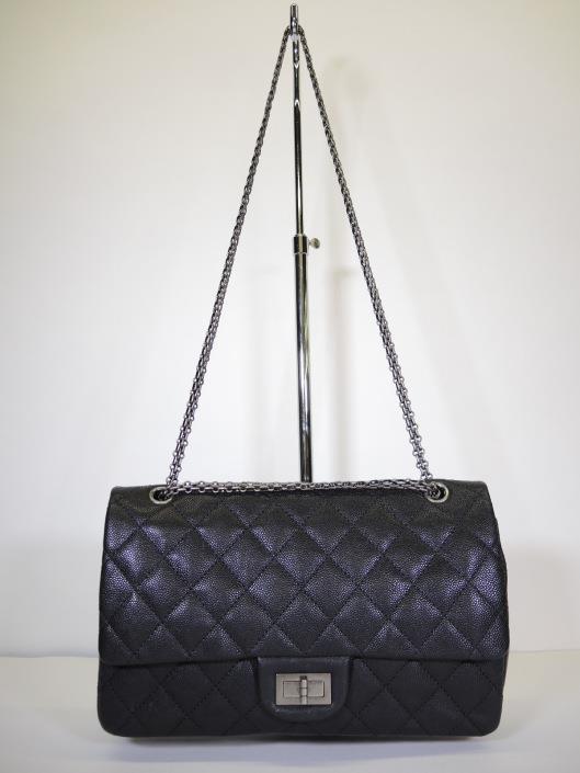 CHANEL 2014 Black Quilted Caviar 2.55 Double Flap ReIssue 227 Retailed for $4,000, sold in one day for $3,000.