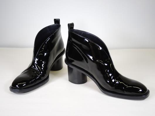 CÉLINE Black Patent V Neck 90 Booties Size 7.5 Retailed for $990, sold in one day for $299. 09/05/17 Celine s minimalist designs are modern and have an unhurried elegance to them.