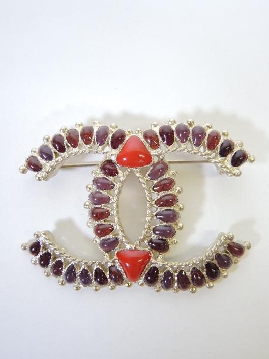 CHANEL 2014 Red and Purple Brooch Sold in one day for $299. 07/08/17 Wear alone or add more to the previous necklace with this CC shaped brooch.