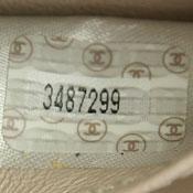 3XXXXXX 1994 to 1996 0's have strikethroughs. 1's are sans-serifs (no feet). Seven digit serial number printed on white sticker with Chanel logos.
