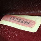 0XXXXXX 1986 to 1988 0's have no strikethroughs.  Note that over time, serial number stickers often become detached from handbags.