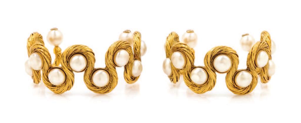 144 144 A Pair of Chanel Goldtone and Faux Pearl Cuffs, with textured goldtone hardware and round faux pearl
