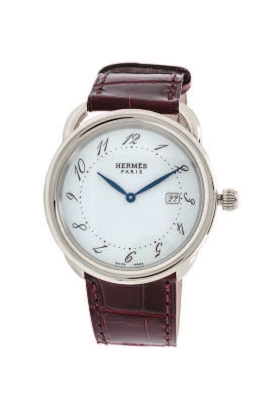 AUCTION HIGHLIGHTS 151 An Hermès Arceau GM Steel Watch, with a white face and a blue tone dial, quartz movement and