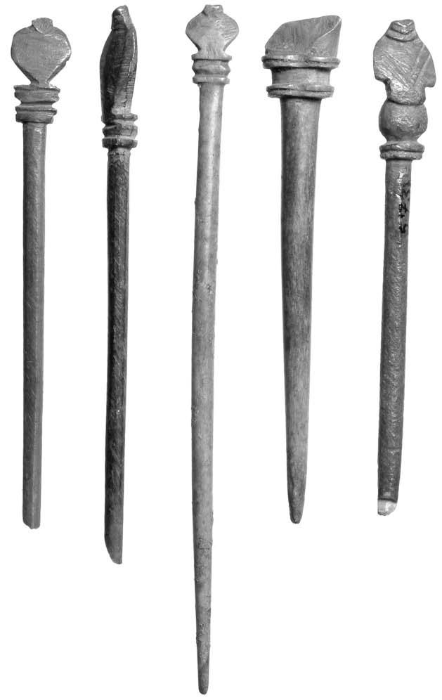 Dedicated followers of fashion? Decorative bone hairpins from Roman London Busts or heads 1. Fig. 1. MoL 559; London. Complete. L. 200 mm; L. of bust 57 mm; W. of bust 18 mm. Henig 1977, 359, pl. 15.