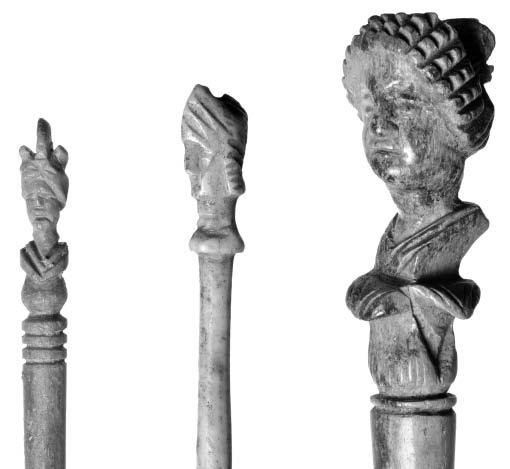 VI.c; 1988, 391-393; Murdoch 1991, n 491. Portion of pin with simple tapering shank and a head set on a pedestal.