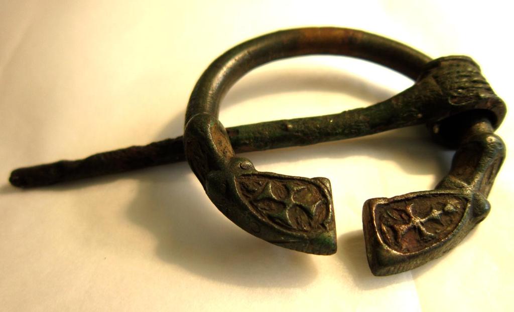 107 6. Bronze Penannular Brooch, Irish, 6-7 th century, bronze, No Locality, Kilbride- Jones # (Group ), NMI 5505.W358 Color: This brooch is a deep gray color, with green areas of oxidation.