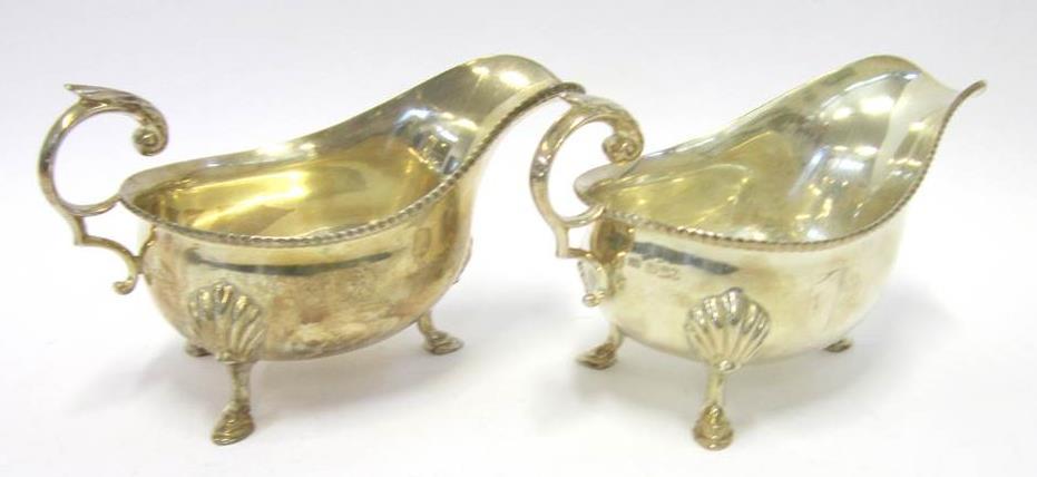 , Cyprus, 1957-1958", 23cm wide 120-180 82 AN ELECTROPLATED SIX BOTTLE CRUET With pierced gallery, two cut glass jars with silver mounts, one bottle lacking, 20cm wide Lot 83 83 A PAIR OF SILVER