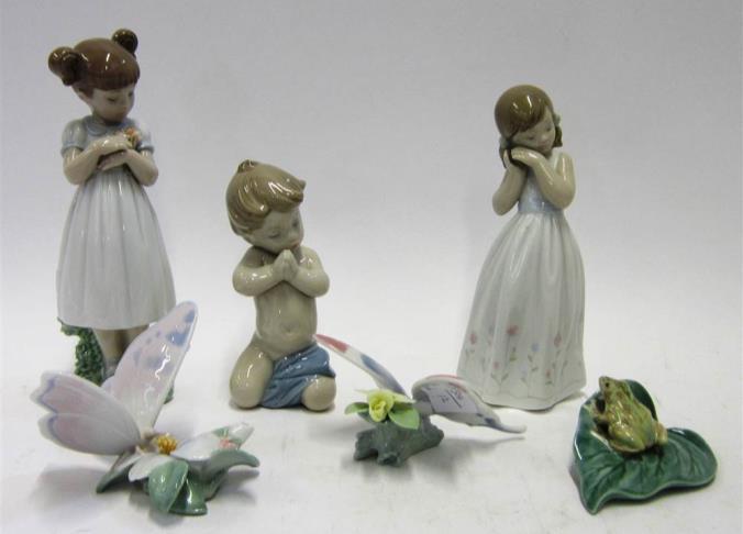 5cm high Lot 187 Lot 184 184 THREE LLADRO PORCELAIN MODELS OF CHILDREN Two modelled as angels, one holding a rabbit, the other a dove; and a model of a young