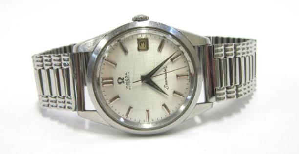 JEWELLERY AND WATCHES Lot 1 1 OMEGA - A STAINLESS STEEL SEAMASTER AUTOMATIC GENT'S WRISTWATCH The silvered dial with baton numerals and date aperture, on associated bracelet, original Omega bracelet