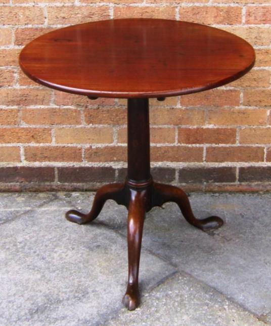 TILT-TOP OCCASIONAL TABLE On turned column and tripod base with cabriole supports and pad feet, 67cm