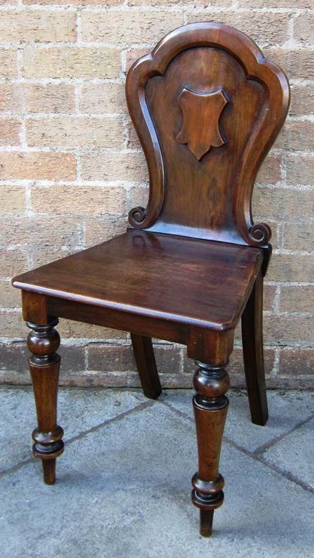 444 A 17TH CENTURY STYLE OPEN ARMCHAIR With cane seat and backrest and with carved frontal stretcher.