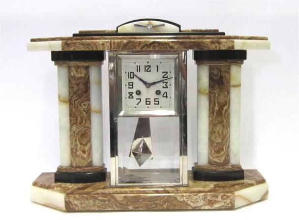 Lot 482 482 AN ART DECO WHITE AND BROWN ONYX MANTLE CLOCK With Arabic numeral dial, striking on a bell, 47cm wide x