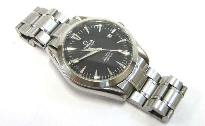 subsidiary seconds dial, on associated expanding bracelet strap 300-500 Lot 46 46 OMEGA - A LADIES STAINLESS STEEL LADYMATIC WRISTWATCH The black dial with gilt baton markers and