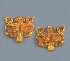 005.353,.354 22 Pair of taotie mask attachments Gold, height 5.